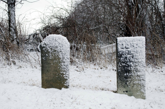 snow on gravestones